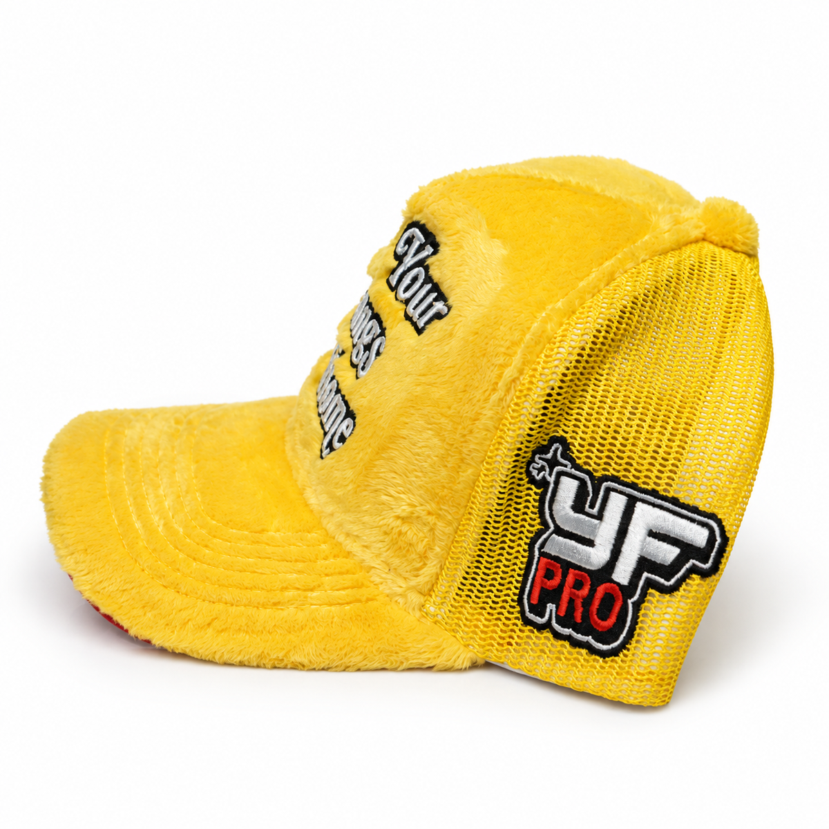 Side view of yellow LYFAH trucker hat showing the embroidered YF PRO patch, yellow mesh and plush curved brim.